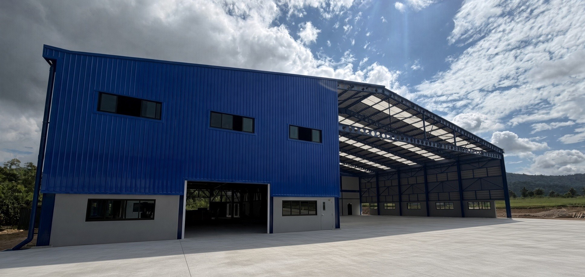 Full front of new workshop and hangar at Hup Bon 5
